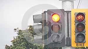 Crossroad traffic light signal for bicyclist, California USA. Bike lane crossing