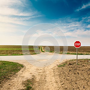 Crossroad with warning sign for priority road