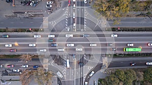 A crossroads with a lot of cars, buses and trucks