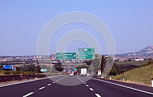 Crossroads with motorway sign with directions to the Italian cit photo