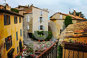 A crossroads seen from a terrace in a typical French provence town