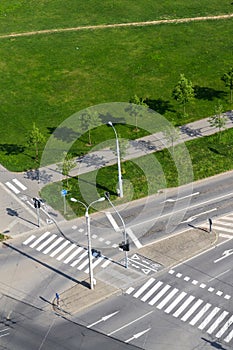 Crosswalk and bike crossing line on empty crossroad, driverless technology