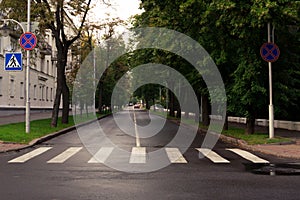 Crosswalk and city street with alone car