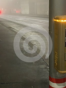 Crosswalk lights in a foggy night