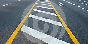 Crosswalk on the road for safety when people walking cross the street, Pedestrian crossing on a repaired asphalt road,