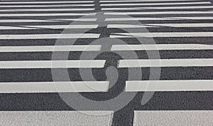 Crosswalk road with zebra pattern for pedestrians on empty city street