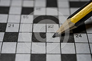 Crossword puzzle and pencil close up shot