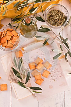 Crostini bread with oregano and olive oil.