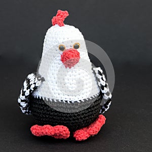 Easter decorations - a crotcheted easter chicken against a black background