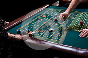 Croupier behind gambling table in a casino.