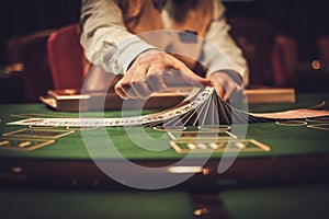 Croupier behind gambling table in a casino