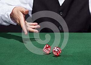 Croupier throwing a pair of dice