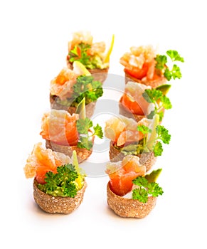 Croustades crispy pastry cases filled with salted salmon and av