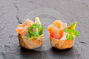 Croustades crispy pastry cases filled with salted salmon and av