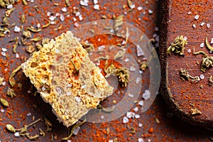 Crouton with salt and spices over wood table