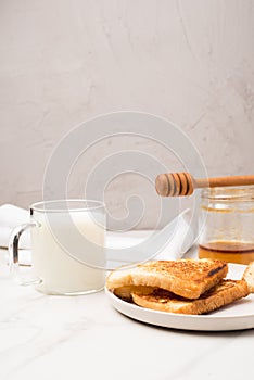 Croutons for breakfast with honey and milk