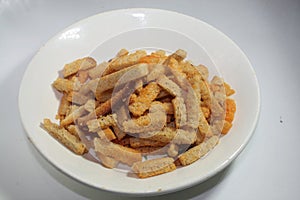 Croutons in a white plate on an  white background