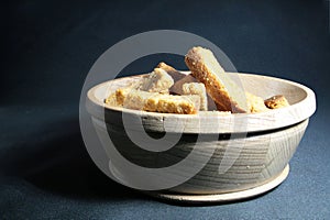 Croutons in wooden on  black background