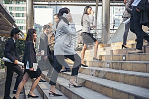 Crowd business people walking step in modern city office life. Group of businesspeople busy life urban street city lifestyle.