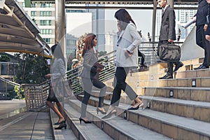 Crowd business people walking step in modern city office life. Group of businesspeople busy life urban street city lifestyle.