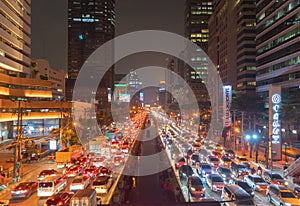 Crowd of busy cars with heavy traffic jam in rush hour on highway road street on bridge in Bangkok Downtown,urban city in Asia,