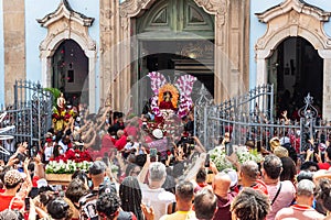 Crowd of Catholics saluting the image of Santa Barbara leaving the church