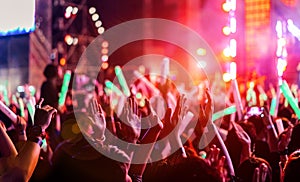 Crowd clap or hands up at concert stage lights