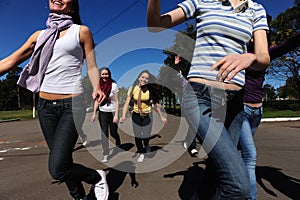 Crowd of crazy and happy teen girls running