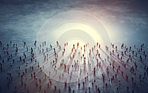 Crowd of diverse people walk to light