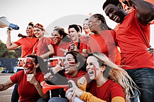 Crowd football fans having fun supporting favorite team