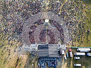 Crowd in front of a stage at a summer music festival