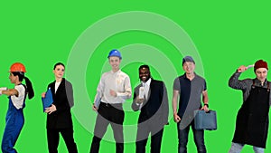Crowd or group of different people dancing on a green screen, chroma key.