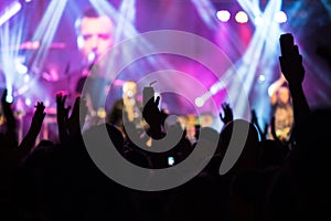 Crowd hands in the air at the concert