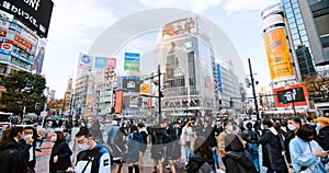 Crowd of Japanese people, commuter, traveler walk cross road at Shibuya scramble crossing