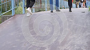 Crowd of Pedestrians Walking on a Concrete Bridge. 4K