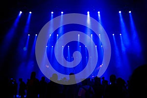 Crowd of people, blue stage lights