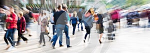 Crowd of people in the city with zoom effect