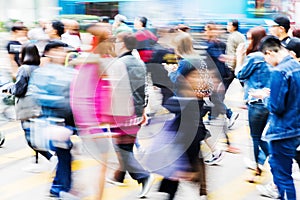 Crowd of people crossing a street