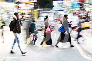 Crowd of people crossing a street in Hongkong