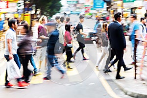 Crowd of people crossing a street in Hongkong