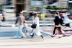 Crowd of people crossing a street with zoom effect