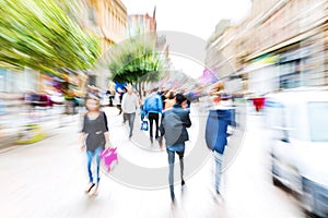 Crowd of people crossing a street with zoom effect