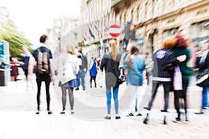 Crowd of people crossing a street with zoom effect