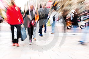 Crowd of people crossing a street with zoom effect