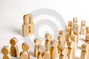 A crowd of people looks at a wooden padlock. The concept of security and safety. Protection of personal data and tangible property