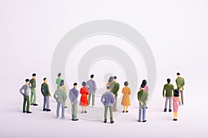 A crowd of people is standing and looking at the white background. People are looking at the white screen. Place for text.