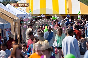 Crowd Of People Walk Around At Festival