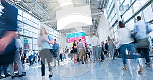 Crowd of people walking a a trade show