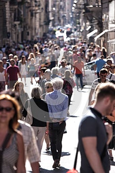 Crowd of people walking in Via del Corso in Rome (Italy)