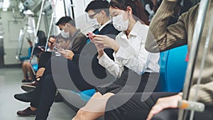 Crowd of people wearing face mask on a crowded public subway train travel